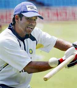 Sachin Tendulkar gives catch practice with a stump 