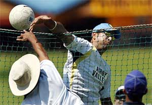 India's Yuvraj Singh hits a smash while playing volleyball 