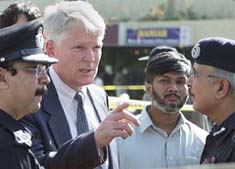 US Consul-General John K. Bauman talks to Pakistani police officials