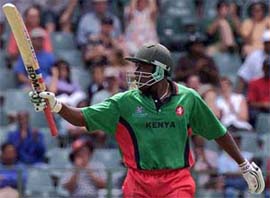 Kenyan batsman Maurice Odumbe celebrates his 50