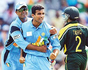 India's Zaheer Khan celebrates with team-mate Dinesh Mongia