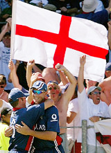 England�s Ashley Giles celebrates with Craig White after taking the catch of Australian captain Ricky Ponting 