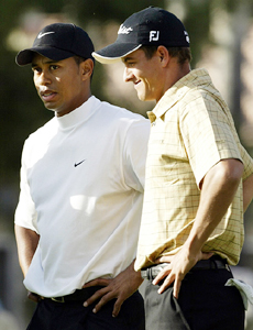 Tiger Woods stands with Australian Adam Scott after winning their semifinal match at the Accenture Match Play Golf championships