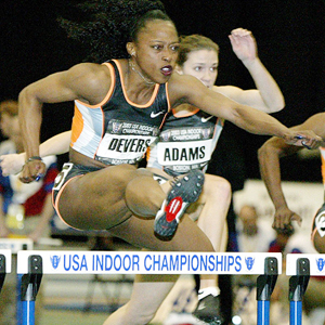 Gail Devers clears a hurdle on her way to setting a new US record in the women's 60 meter hurdles