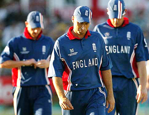 English captain Nasser Hussain leaves the field followed by Paul Collingwood and Ashley Giles 