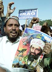 A Pakistani Islamist holds a poster of Al-Qaida leader Osama bin Laden during a protest rally
