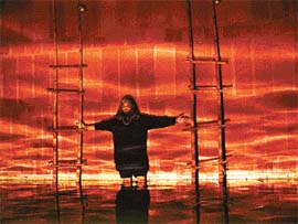 Shridhar Iyer poses in the middle of the installation work which he has created in PU Fine Arts Museum to aesthetically depict various rituals performed after death