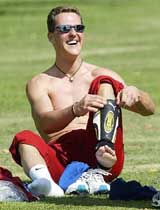 Formula One champion Michael Schumacher prepares for a friendly game of soccer 