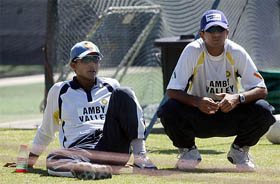 Indian captain Saurav Ganguly and vice-captain Rahul Dravid watch team mates train in Cape Town 