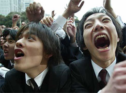 Japanese students shout to cheer themselves at a job-hunting rally in Tokyo 
