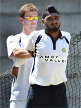 India's physiotherapist Andrew Leipus helps Harbhajan Singh to work out 