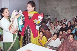 A group from the Indian Council for Children Welfare presents a puppet show as part of Women�s Week celebrations at Maloya village