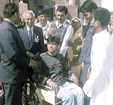 A physically challenged person being given a wheelchair at a function organised by Tarun Mitra Parishad on Thursday.