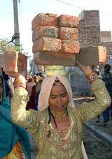 Carrying the usual load of life even on the eve of Women�s Day 