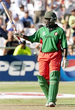 Kenyan batsman Kennedy Obuya celebrates his fifty