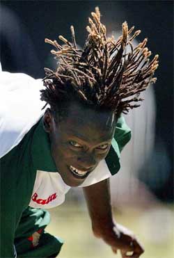 Zimbabwe bowler Henry Olonga�s hair flies as he bowls in the nets 