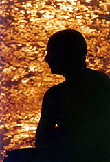 A holy man prays at dawn