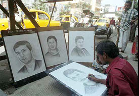 An artiste in Kolkata cheers the Indian team