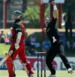 New Zealand�s Chris Cairns celebrates after Zimbabwe�s Craig Wishart