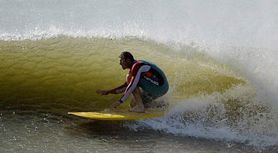 Australian batsman Matthew Hayden surfs at Jeffreys Bay 