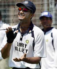Indian captain Saurav Ganguly applauds a shot while playing volleyball 