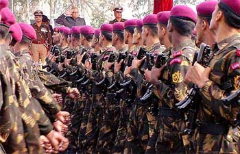 Deputy Prime Minister L.K. Advani takes salute on the occasion of the CISF raising day parade