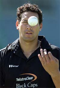 New Zealand bowler Daryl Tuffy tosses the ball during a practice session 
