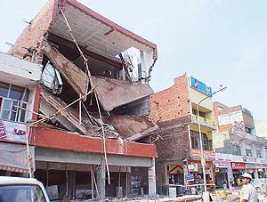 An under-construction multi-storeyed building that collapsed in Phase V market in the wee hours of Tuesday in SAS Nagar. 