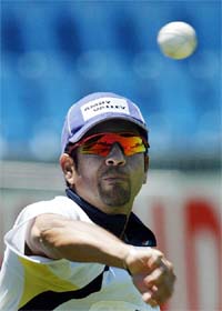 Sachin Tendulkar bowls during a practice session 