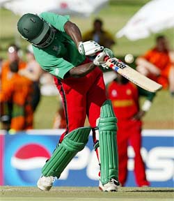 Kenya's Maurice Odumbe hits a four