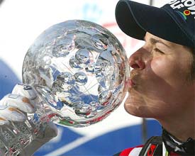 Michaela Dorfmeister of Austria kisses the Skiing World Cup Downhill trophy 