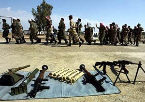 Members of an Arab Volunteer Unit practise in a military base near Baghdad