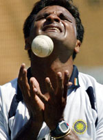 Javagal Srinath reacts as he catches a ball during a practice session