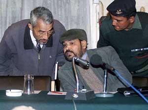 Nepal Communist Party (Maoist) rebel leader Krishna Bahadur Mahara consults with Maoist and government talks facilitator Dr. Birendra Jhapali