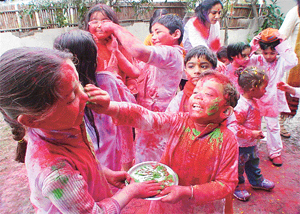 Children of the Strawberry Club celebrate Holi on the club premises at Sarabha Nagar in Ludhiana on Friday.
