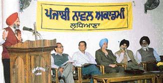 Members of the Punjabi Novel Academy hold a discussion
