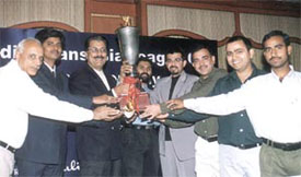 Former Pakistani cricketer Zaheer Abbas presents the Media Transasia Cup to the winning team 