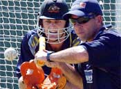 Adam Gilchrist practices with Jimmy Maher in Port Elizabeth