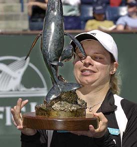 Top-seeded Kim Clijsters of Belgium hoists the winner's trophy
