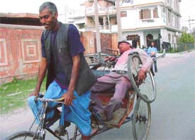 Reveller high on bhang being carried home at Kitchlu Nagar