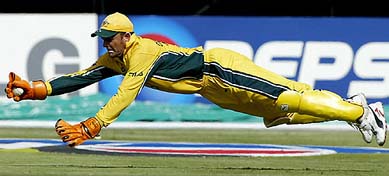 Australian wicketkeeper Adam Gilchrist dives to stop a ball during their semifinal match against Sri Lanka 