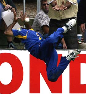 Sri Lanka's Marvan Atapattu makes a heroic attempt to take a catch of Australia's Andy Bichel