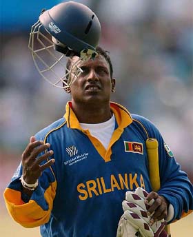Sri Lanka�s Aravinda de Silva tosses his helmet after being run out