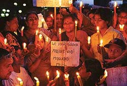 Members of the Indian Council of Social Welfare take out a candlelight procession against the war on Iraq