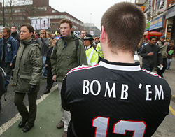 A pro-war demonstrator watches a protest against war in central Manchester 