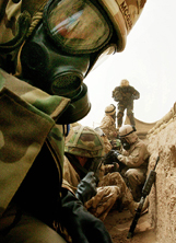 US and British troops and journalists take shelter in scud trenches during an alert of Iraqi scud missile attacks