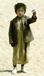 A boy offers a pack of cigarettes