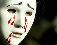 An anti-war protester wears a mask during a demonstration in Central London 