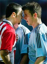 Yugoslav striker Mateja Kezman of PSV Eindhoven argues with Rafael van der Vaart of Ajax 