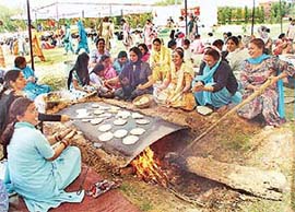 Women prepare �langar� on �sadbhavna divas� organised by the Panjab University Non-Teaching Employees Federation in Chandigarh